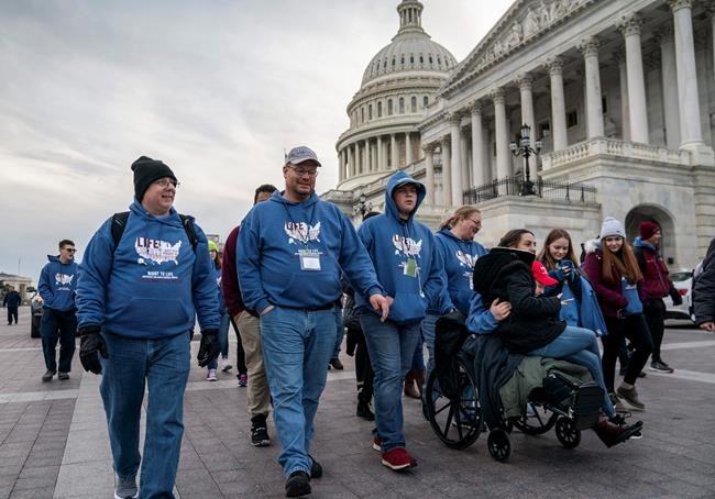 As the impeachment trial of President Donald Trump is conducted inside the Senate, activists attending the March for Life anti-abortion rally visit the Capitol in Washington, Thursday, Jan. 23, 2020. The White House says President Trump will become the first president to attend the annual gathering on Friday. (AP Photo/J. Scott Applewhite)