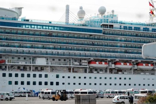 The cruise ship Diamond Princess is anchored at the Yokohama Port in Yokohama, near Tokyo Friday, Feb. 7, 2020. Japan on Friday reported 41 new cases of a virus on a cruise ship that's been quarantined in Yokohama harbor while the death toll in mainland China rose to 636, including a doctor who got in trouble with authorities in the communist country for sounding an early warning about the disease threat. (AP Photo/Eugene Hoshiko)