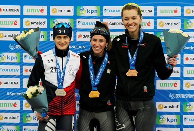 From Left: Martina Sablikova of Czech Republic, second place, Ivanie Blondin of Canada, first place, and Isabelle Weidemann of Canada third place stand on the podium after the ladies 5000 meters race of the speed skating World Cup at the Alau Ice Palace in Nur-Sultan, Kazakhstan, Friday, Dec. 6, 2019. (AP Photo/Stas Filippov)