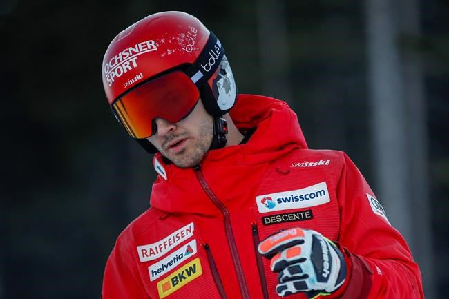 Switzerland's Loic Meillard checks the slope ahead of an alpine ski, men's World Cup giant slalom, in Bansko, Sunday, Feb. 28, 2021. (AP Photo/Gabriele Facciotti)