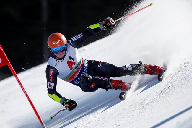 Croatia's Filip Zubcic speeds down the slope during an alpine ski, men's World Cup giant slalom, in Bansko, Saturday, Feb. 27, 2021. (AP Photo/Gabriele Facciotti)