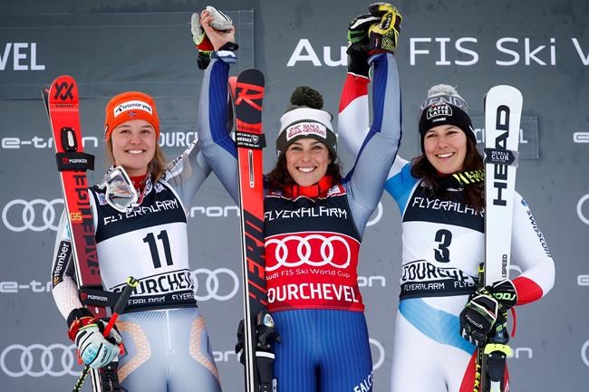 From left, second placed Mina Fuerst Holtmann of Norway, winner Federica Brignone of Italy and third placed Wendy Holdener of Switzerland celebrate on the podium of an alpine ski, women's World Cup giant slalom in Courchevel, France, Tuesday, Dec. 17, 2019. (AP Photo/Gabriele Facciotti)