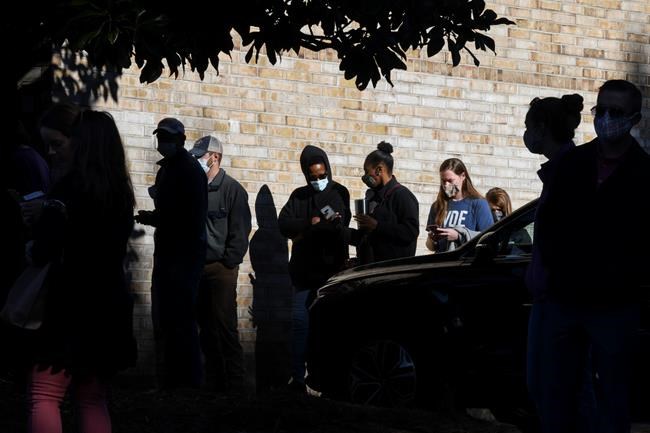 Voters wait in line to cast their ballots in the 2020 election Tuesday, Nov. 3, 2020, in Auburn, Ala. (AP Photo/Julie Bennett)