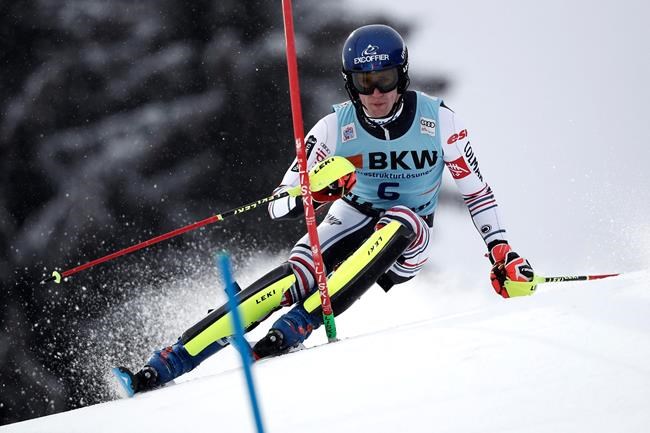 France's Clement Noel speeds down the course during an alpine ski, men's World Cup slalom in Flachau, Austria, Saturday, Jan. 16, 2021. (AP Photo/Gabriele Facciotti)