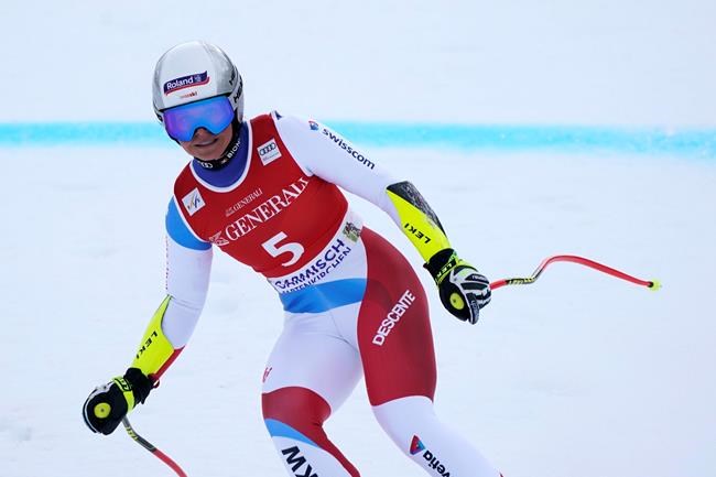 Switzerland's Corinne Suter reacts in the finish area of an alpine ski, women's World Cup super-G race in Garmisch-Partenkirchen, Germany, Monday, Feb. 1, 2021. (AP Photo/Giovanni Auletta)