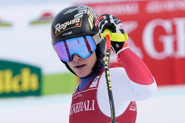 Switzerland's Lara Gut-Behrami reacts in the finish area of an alpine ski, women's World Cup super-G race in Garmisch-Partenkirchen, Germany, Monday, Feb. 1, 2021. (AP Photo/Giovanni Auletta)