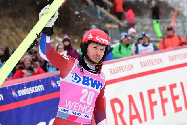 Third placed Russia's Alexander Khoroshilov celebrates at the end of an alpine ski, men's World Cup slalom in Wengen, Switzerland, Sunday, Jan. 19, 2020. (AP Photo/Marco Tacca)