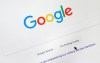 FILE - In this Aug. 28, 2018, file photo, a cursor moves over Google's search engine page, in Portland, Ore. A French appeals court on Thursday, Oct. 8, 2020 upheld an order for Google to pay media companies to show their news content in search results. The Paris Court of Appeal rejected a challenge by the U.S. tech company, which had refused to comply with an order by France's competition authority to negotiate with publishers and press agencies for payments to display their material. (AP Photo/Don Ryan, File)