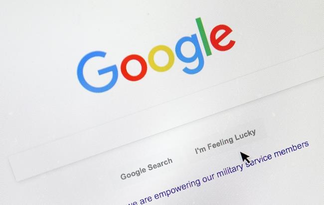 FILE - In this Aug. 28, 2018, file photo, a cursor moves over Google's search engine page, in Portland, Ore. A French appeals court on Thursday, Oct. 8, 2020 upheld an order for Google to pay media companies to show their news content in search results. The Paris Court of Appeal rejected a challenge by the U.S. tech company, which had refused to comply with an order by France's competition authority to negotiate with publishers and press agencies for payments to display their material. (AP Photo/Don Ryan, File)