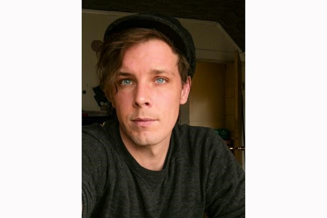 In this March 29, 2020 photo, Spokane cook Jason W. Still, 30, in seen in this portrait in Spokane, Wash. Still and most other kitchen workers at the fine dining restaurant Clover were laid off from their jobs after the state's restaurants were closed for seated service under social distancing guidelines put in place to slow the spread of the coronavirus Still is waiting to learn how much in unemployment payments he will qualify for while working on applications for graduate school. His wife has kept her job in the legal marijuana industry and he has some savings, but Still says after this month it will be a struggle to pay the rent. (Jason W. Still via AP)