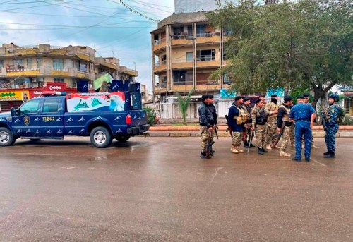 Security forces are deployed in empty streets to impose a curfew, in Baghdad, Iraq, Wednesday, March 18, 2020. Iraq announced a weeklong curfew to help fight the spread of the coronavirus. For most people, the virus causes only mild or moderate symptoms. For some it can cause more severe illness. (AP Photo/Khalid Mohammed)