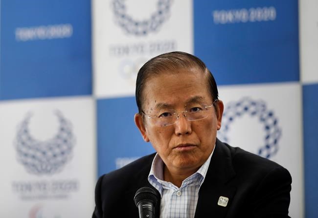 In this June 11, 2019, file photo, Toshiro Muto, CEO of the 2020 Tokyo Olympics organizing committee, listens to questions from the media during a news conference in Tokyo. Tokyo CEO Muto and other Olympic officials are proposing that the government relax immigration regulations, allowing athletes to enter the country before next year’s postponed games and train during a 14-day quarantine period. (AP Photo/Jae C. Hong, File)
