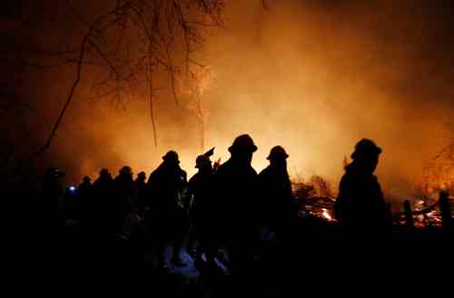 CP
Marines are silhouetted against a raging fire in the Chiquitania Forest in Santa Rosa de Tucabaca, on the outskirts of Robore, Bolivia, Wednesday, Aug. 28, 2019. While some of the fires are burning in Bolivia's share of the Amazon, the largest blazes were in the Chiquitanía region of southeastern Bolivia. It's zone of dry forest, farmland and open prairies that has seen an expansion of farming and ranching in recent years. (AP Photo/Juan Karita)