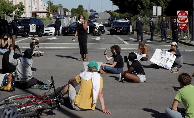 Protestors block an intersection outside the Oakland police department on Thursday, May 28, 2020, in Oakland, Calif. (AP Photo/Ben Margot)