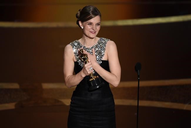 Hildur Guonadottir accepts the award for best original score for