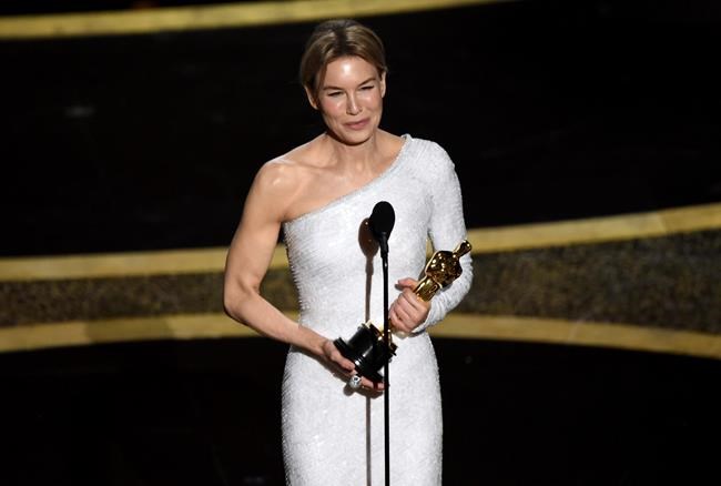Renee Zellweger accepts the award for best performance by an actress in a leading role for