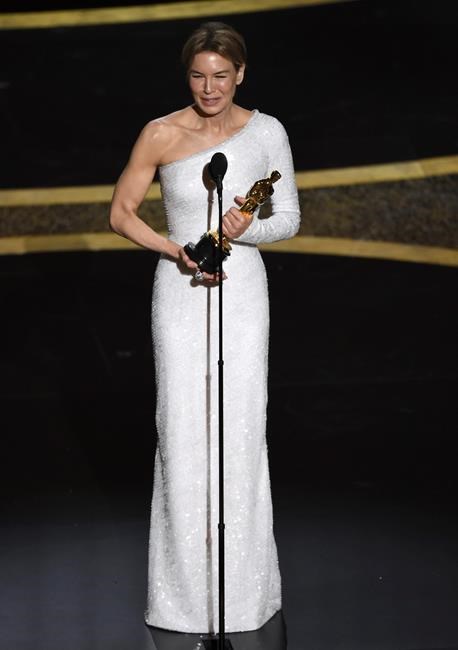 Renee Zellweger accepts the award for best performance by an actress in a leading role for