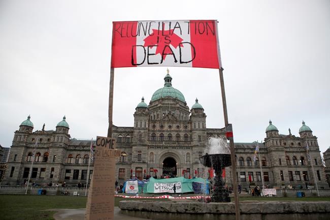Wet'suwet'en protesters camp out in front of legislature before the speech from the throne in Victoria, B.C., on Tuesday, February 11, 2020. THE CANADIAN PRESS/Chad Hipolito