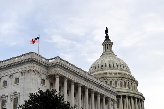The flag flies outside the U.S. Capitol ahead of President Donald Trump delivering his State of the Union address to a joint session of Congress on Capitol Hill in Washington, Tuesday, Feb. 4, 2020. (AP Photo/Susan Walsh)