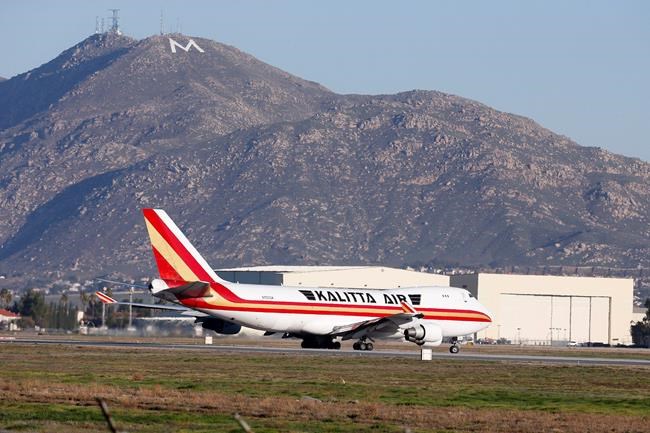 An airplane carrying U.S. citizens being evacuated from Wuhan, China, takes off at March Air Reserve Base in Riverside, Calif. Jan. 29, 2020. The passengers will undergo additional screenings in California and be placed in temporary housing. Officials have not said how long they will stay there. (AP Photo/Ringo H.W. Chiu)