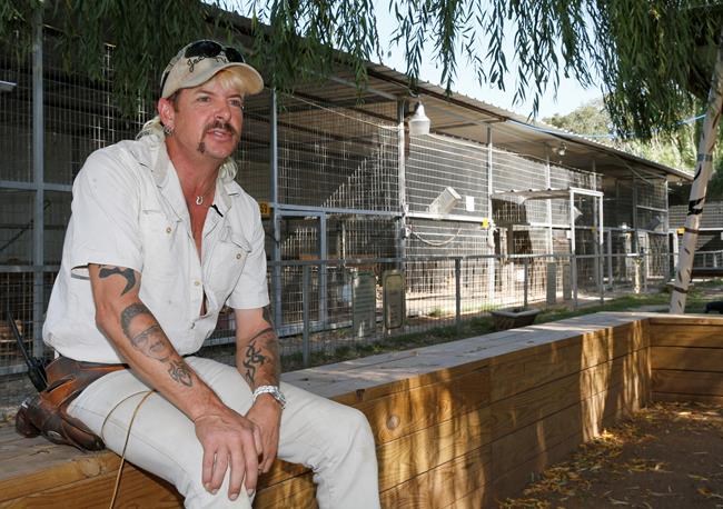 FILE - In this Aug. 28, 2013, file photo, Joseph Maldonado-Passage, also known as Joe Exotic, is seen at the zoo he used to run in Wynnewood, Okla. A federal judge in Oklahoma has ordered the new owners of the Oklahoma zoo featured in Netflix's