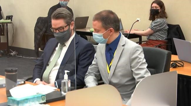 In this image from video, defense attorney Eric Nelson, left, and defendant, former Minneapolis police officer Derek Chauvin listen to Hennepin County Judge Peter Cahill read instructions to the jury before closing arguments, Monday, April 19, 2021, in the trial of Chauvin at the Hennepin County Courthouse in Minneapolis. Chauvin is charged in the May 25, 2020 death of George Floyd. (Court TV via AP, Pool)