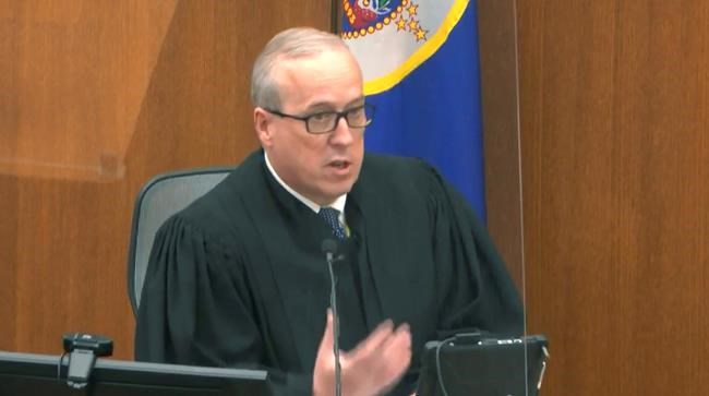 In this image from video, Hennepin County Judge Peter Cahill reads instructions to the jury before closing arguments, Monday, April 19, 2021, in the trial of former Minneapolis police officer Derek Chauvin at the Hennepin County Courthouse in Minneapolis. Chauvin is charged in the May 25, 2020 death of George Floyd. (Court TV via AP, Pool)