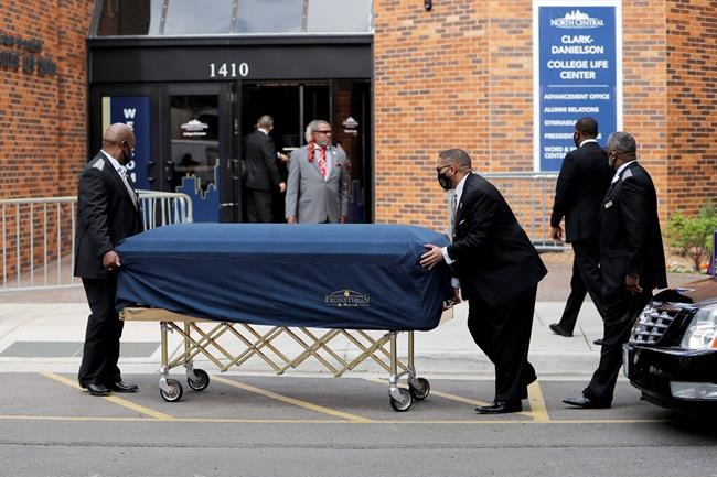 The body of George Floyd arrives before his memorial services on Thursday, June 4, 2020 in Minneapolis. (AP Photo/Julio Cortez)