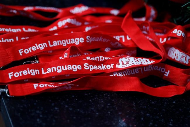 Lanyards stand at the ready for volunteers who speak foreign languages to wear while answering telephones in the NORAD Tracks Santa center at Peterson Air Force Base, Monday, Dec. 23, 2019, in Colorado Springs, Colo. More than 1,500 volunteers will answer an estimated 140,000 calls from children and their parents from around the globe to check on the whereabouts of Santa Claus on Christmas Eve. (AP Photo/David Zalubowski)