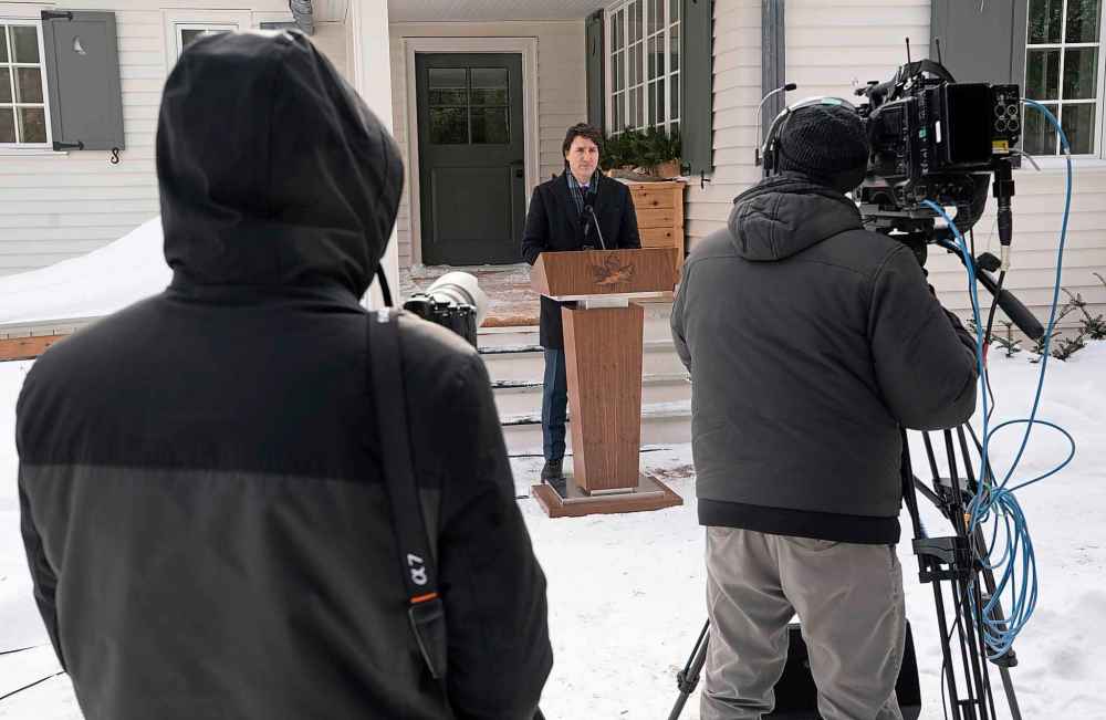 Cameras record Canadian Prime Minister Justin Trudeau as he speaks during a media availability held at a secure location, Monday, January 31, 2022 in National Capital Region. THE CANADIAN PRESS/Adrian Wyld