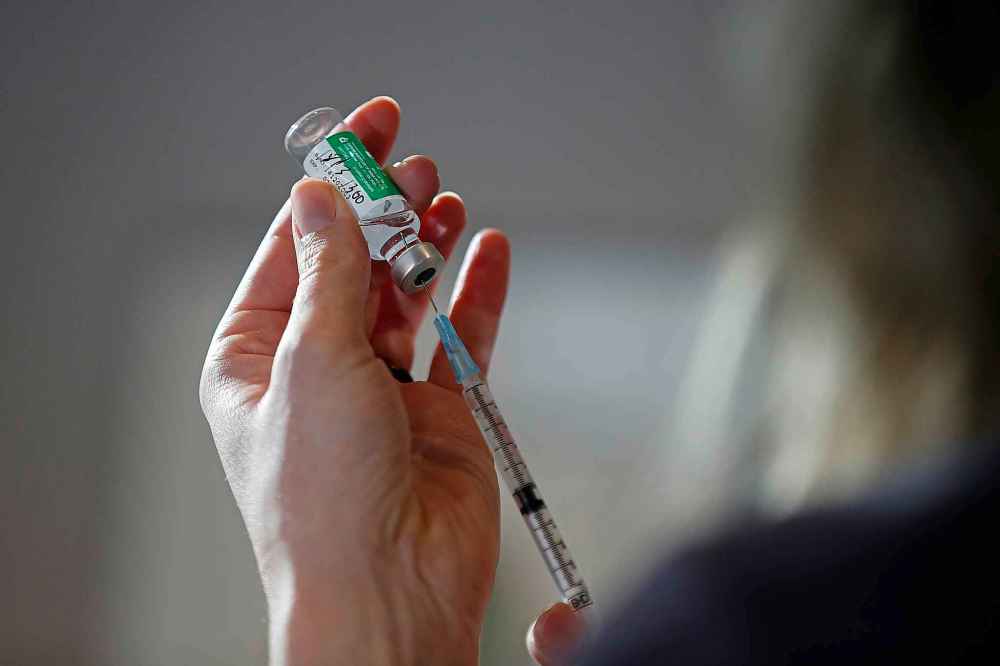 CP
Dr. Joss Reimer, medical lead, Manitoba Vaccine Implementation Task Force draws a dose of the AstraZeneca COVID-19 vaccine at a clinic in Winnipeg, Friday, March 19, 2021. THE CANADIAN PRESS/John Woods