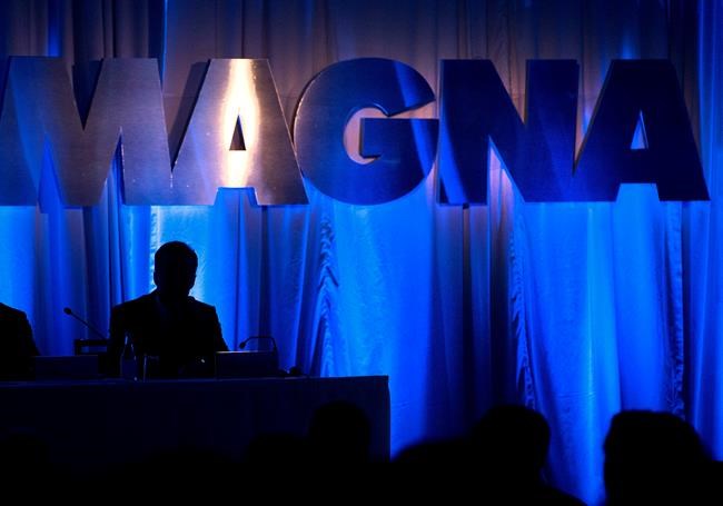 The Magna International Inc. logo is seen prior to the company's annual general meeting to begin in Toronto on May 10, 2013. THE CANADIAN PRESS/Nathan Denette
