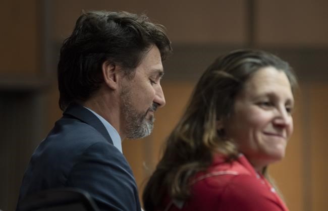 Prime Minister Justin Trudeau sits beside Deputy Prime Minister and Minister of Intergovernmental Affairs Chrystia Freeland before speaking to members of caucus on Parliament Hill in Ottawa, Thursday, January 23, 2020.Trudeau has created a new cabinet committee to deal with the novel coronavirus outbreak which began in China but now has spread around the world. Freeland will chair the group, while Treasury Board President Jean-Yves Duclos will be vice-chair. THE CANADIAN PRESS/Adrian Wyld