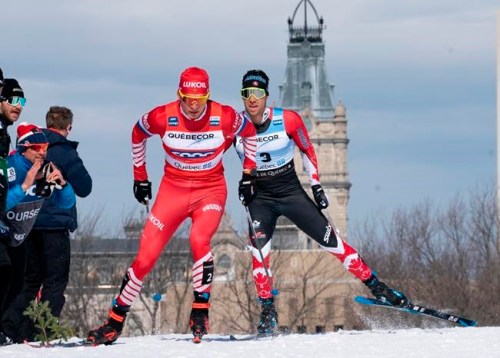 Alexander Bolshunov of Russia, left, and Alex Harvey of St-Ferreol-les-Neiges Que. race during the men's 15 km pursuit free Sunday, March 24, 2019 at the COOP FIS cross country world cup in Quebec City. The World Cup cross-country ski event this weekend in Quebec City has been cancelled because of the COVID-19 outbreak. THE CANADIAN PRESS/Jacques Boissinot