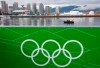 Police officers patrol the waters of False Creek by boat near the athletes village and GM Place in downtown Vancouver, Tuesday, Feb. 2, 2010. The 10-year anniversary of the Olympic Games is on Wednesday. THE CANADIAN PRESS/Jonathan Hayward