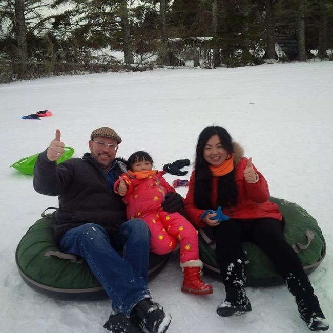 Monte Gisborne, his wife Daniela Luo and daughter Dominica Gisborne are shown in this undated handout photo. A Coquitlam, B.C., resident says he is