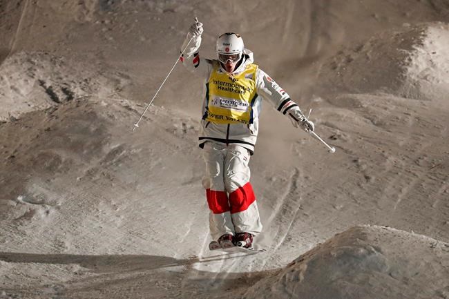 Mikael Kingsbury, of Canada, celebrates as he finishes his final run during the World Cup freestyle men's dual moguls skiing event in Park City, Utah, on February 8, 2020. Canadian freestyle skiing star Mikael Kingsbury climbed the World Cup podium for the ninth time this season on Sunday, finishing second in a dual moguls event. The 27-year-old from Deux-Montagnes, Que., finished behind Japanese rival and friend Ikuma Horishima. THE CANADIAN PRESS/AP, Jeff Swinger