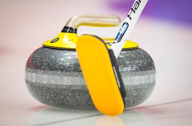 Team Manitoba skip Mike McEwen lines up a shot during the third draw against team Quebec at the Brier in Brandon, Man., Sunday, March, 3, 2019. Every time the national curling championships roll around, the competition format becomes a talking point. THE CANADIAN PRESS/Jonathan Hayward