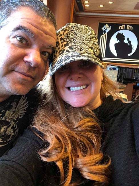 Roger and Karey Maniscalco pose in this undated handout photo. A Canadian-American couple on-board a cruise ship that has been quarantined off the coast of Japan say they're
