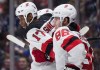 New Jersey Devils' Wayne Simmonds (17) and Jack Hughes (86) celebrate Simmonds' goal during first period NHL hockey action against the Vancouver Canucks, in Vancouver, Sunday, Nov. 10, 2019. While Wayne Simmonds calls the Akim Aliu-Bill Peters story 