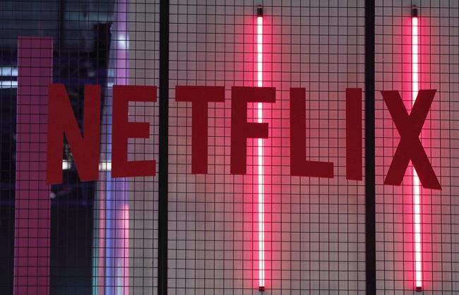 The logo of American entertainment company Netflix is pictured at the Paris games week in Paris, Saturday, Nov. 4, 2017. Netflix has announced a US$100 million global relief fund to support workers in the creative community, including Canada's, amid the COVID-19 pandemic. THE CANADIAN PRESS/AP/Christophe Ena