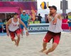 Canada's Samuel Pedlow, right, returns a shot as teammate Sam Schachter looks on during the beach volleyball final against Australia at the Commonwealth Games Thursday, April 12, 2018 in Gold Coast, Australia. THE CANADIAN PRESS/Ryan Remiorz
