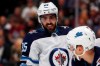 Winnipeg Jets left wing Mathieu Perreault confers with defenseman Neal Pionk, right, during the first period of the team's NHL hockey game against the Colorado Avalanche on Tuesday, Dec. 31, 2019, in Denver. Perreault is livid after the NHL's Department of Player Safety decided not to hand out any discipline to Vancouver Canucks forward Jake Virtanen following a controversial play Tuesday. THE CANADIAN PRESS/AP/David Zalubowski