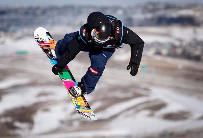 Austria's Clemens Schattschneider, soars over a jump on his way to winning the men's World Cup slopestyle snowboard event in Calgary, Alta., Saturday, Feb. 26, 2011. Calgary is making a pitch to be a World Cup hub for both freestyle skiing and snowboard. THE CANADIAN PRESS/Jeff McIntosh