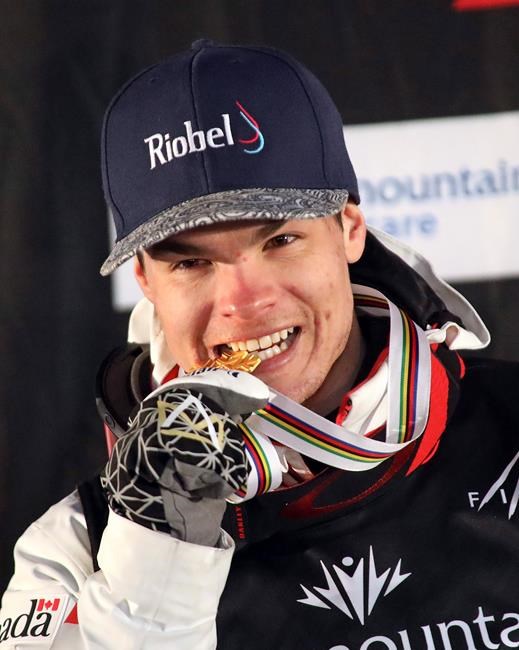 Winner Mikael Kingsbury celebrates on the podium following the men's skiing moguls world championships Friday, Feb. 8, 2019, in Park City, Utah. Kingsbury had some trouble squeezing all of his trophies into one photo when he tried to display them in a shot he shared on Twitter last week. The reigning Olympic moguls champion begins his quest for a ninth straight Crystal Globe trophy this weekend in Ruka, Finland, where he'll get his 100th career World Cup start. THE CANADIAN PRESS/AP/Rick Bowmer