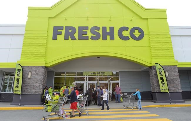 People enter a FreshCo store in Mission, B.C. on Thursday, April 25, 2019. Worrying about being infected with COVID-19 at the grocery store where she works has become part of the job for Kelly Ferguson, who lives with her 90-year-old mother. THE CANADIAN PRESS/Jonathan Hayward