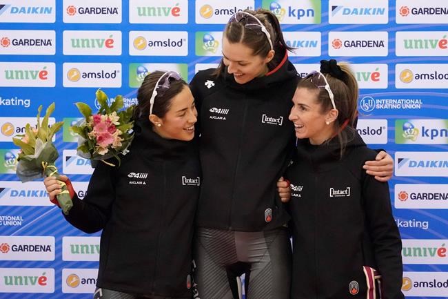 Second placed Canada team, Ivanie Blondin, Isabelle Weidemann and Valerie Maltais, celebrate on the podium during a medal ceremony for the ladies team pursuit race of the speed skating World Cup at the M-Wave in Nagano, Japan, Sunday, Dec. 15, 2019. Ivanie Blondin and Isabelle Weidemann are accustomed to observations about their height differential. THE CANADIAN PRESS/AP-Toru Hanai
