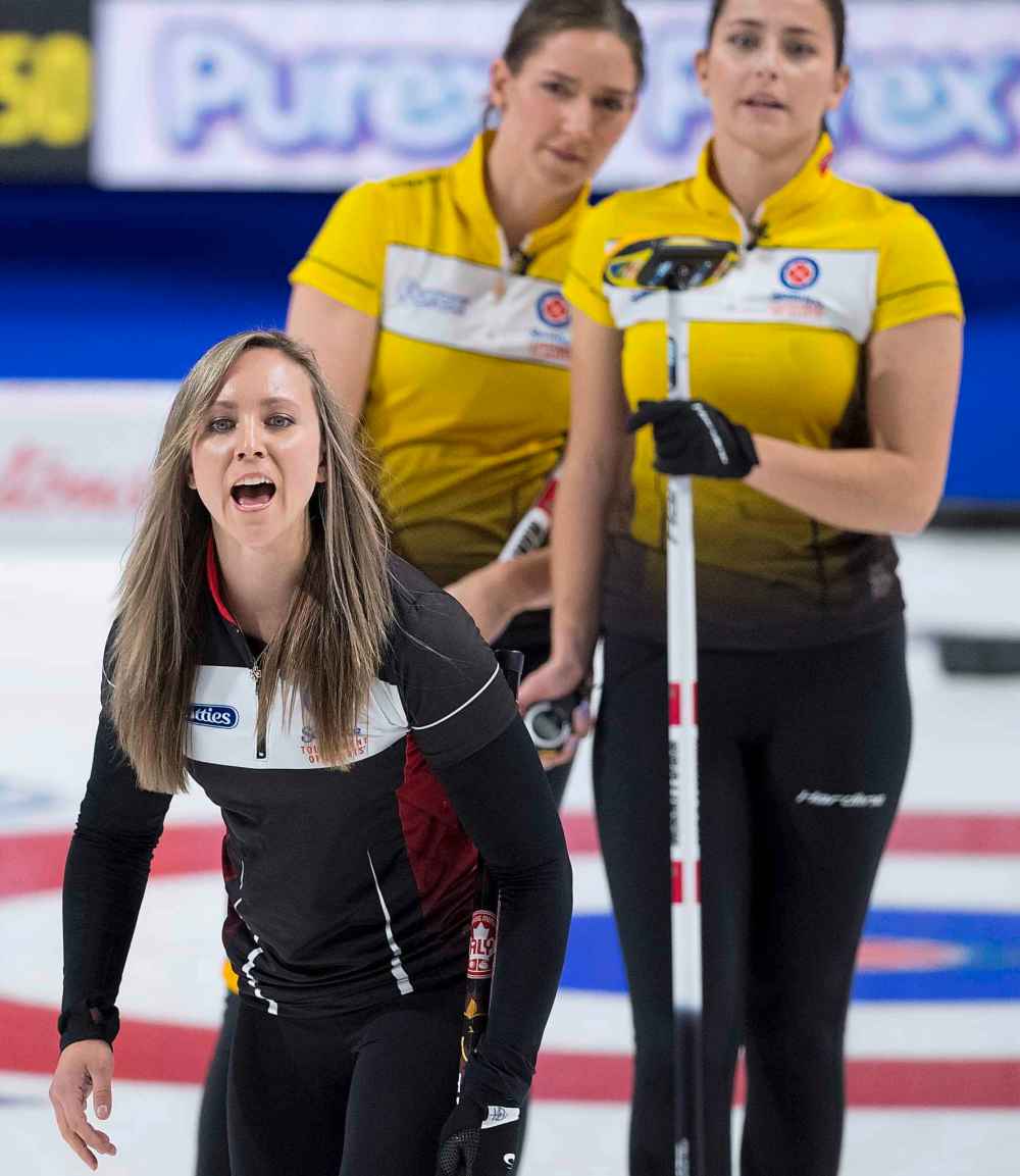Team Manitoba lead, Briane Meilleur and second, Shannon Birchard look on as Team Ontario skip, Rachel Homan calls a shot. (Jonathan Hayward / The Canadian Press)