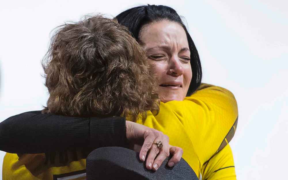 Team Manitoba skip, Kerri Einarson hugs coach, Patti Wuthrich after defeating Team Ontario. (Jonathan Hayward / The Canadian Press)