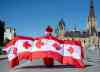 CP
Andrew Larche wears an outfit made up of multiple Canadian flags as he walks on Parliament Hill on July 1, 2019. Canadian Heritage, the department in charge of planning the Canada Day show, cancelled the in-person event this year due to public health concerns related to the COVID-19 pandemic. (Justin Tang / Canadian Press files)